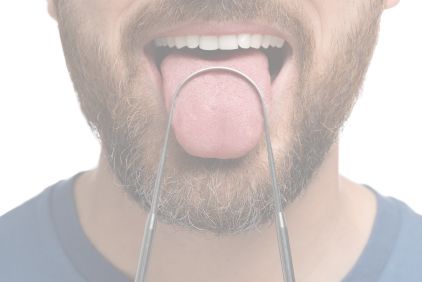 Photo of a man using a tongue scraper.
